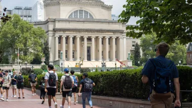 Students at the Columbia University campus with the Low Memorial Library in the background